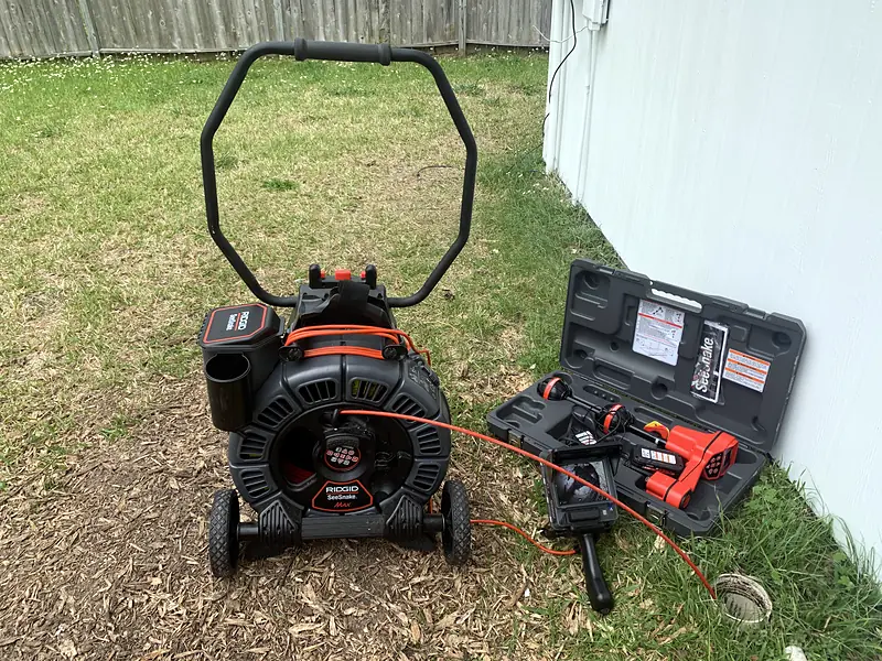 Royal Flush Affordable Plumbing sewer camera and locator set up on a Houston lawn