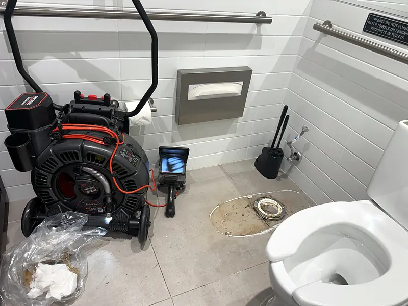 Sewer camera with a monitor in a restroom