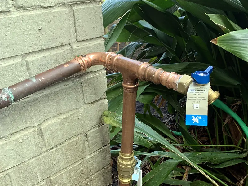 New copper main shutoff valve at a brick house