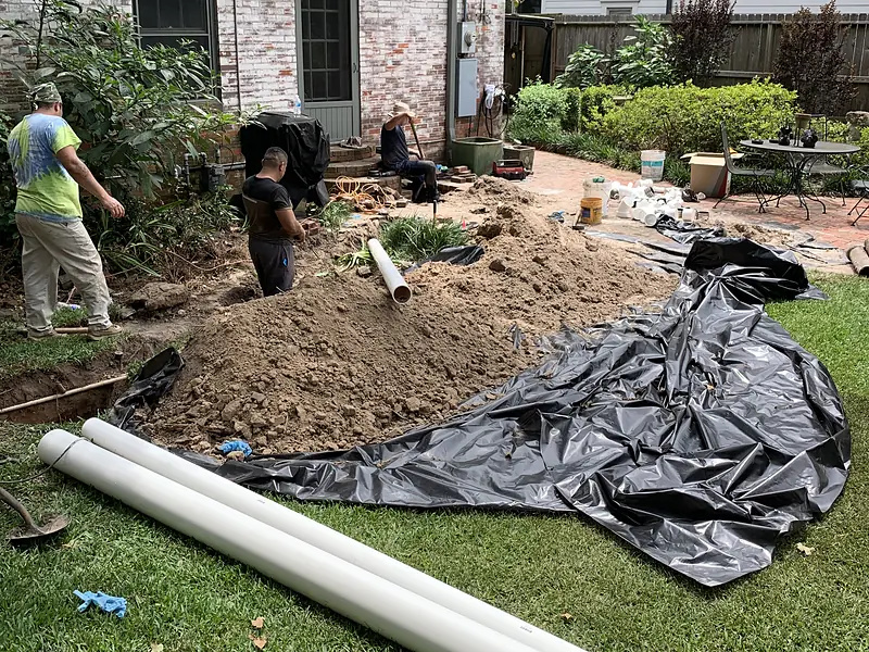 Sewer line replacement job staged in a Houston front yard by Royal Flush Affordable Plumbing