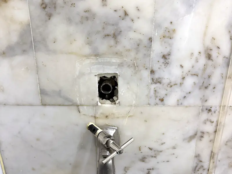 Shower valve on marble, before