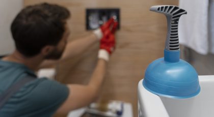 side-view-man-working-as-plumber drain cleaning services